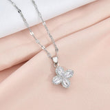 Rotatable Titanium Steel Four-petal Flower Necklace Female Inlaid Zircon Ring Earrings